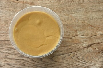 palm sugar in circle transparent plastic box packaging on table