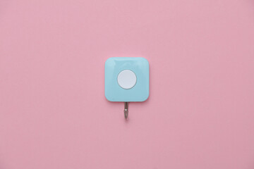 Wall hook for kitchen or bathroom on pink pastel background