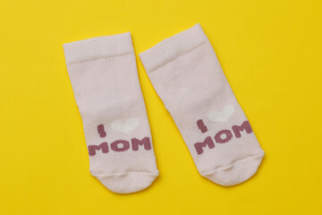 children's Socks with text i love mom on a yellow background