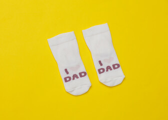 children's Socks with text i love dad on a yellow background