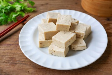 Vietnamese Pork Sausage  on a white plate ,cube Vietnamese Pork sausauge on wooden background