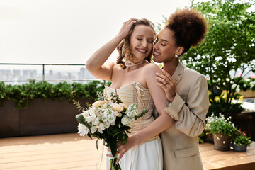 A lesbian couple celebrates their wedding day with a tender embrace on a rooftop.