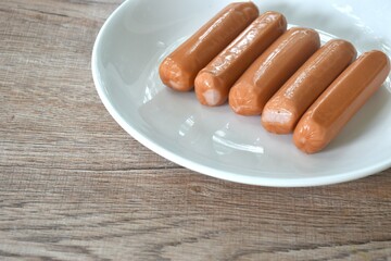 raw long smoked pork sausage arranging on plate 