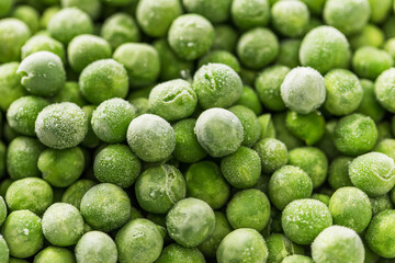 Close-up of frozen green peas. Healthy and fresh vegetables with frost on them