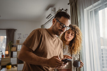 Husband want to use mobile phone alone while his wife try to join him