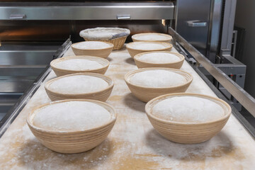 close up of sourdough in a banetton for proofing before baking in an oven.  