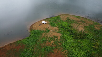 Aerial view of fishing tent in dam Thailand.