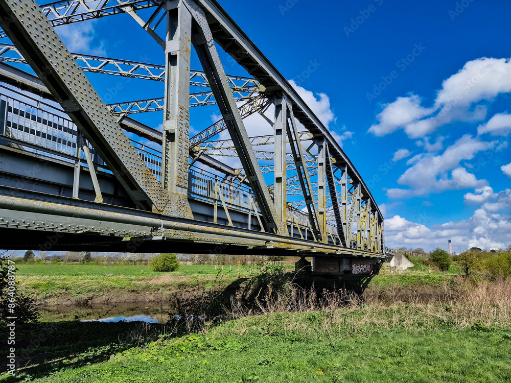 Wall mural Metal girder bridge across a river