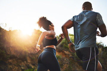 Back view, woman and man running on mountain for fitness, exercise and together for wellness....