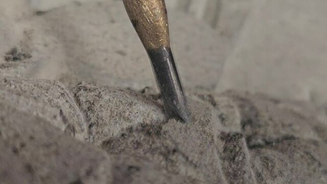 Sculptor Carving On stone. Working with stone and sculpting statue. Extreme Closeup