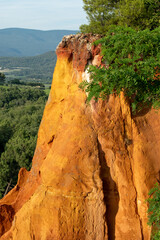 View of ochre cliffs and surrounding landscape, photographed from the historic town of Roussillon, Provence in the south of France.