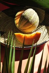 orange melon on a green background