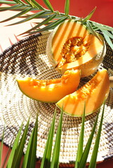 orange melon on a green background