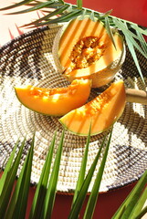 orange melon on a green background