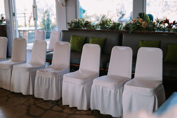 White fabric-covered chair, perfect for a stylish and elegant seating arrangement