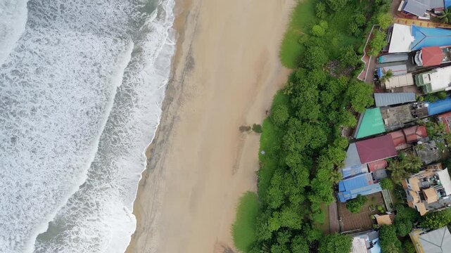 Shoreline of Varkala Cliff Beach, drone view of Varkala beach from the top of the cliff also known as Papanasham Beach, Thiruvananthapuram, Kerala, India