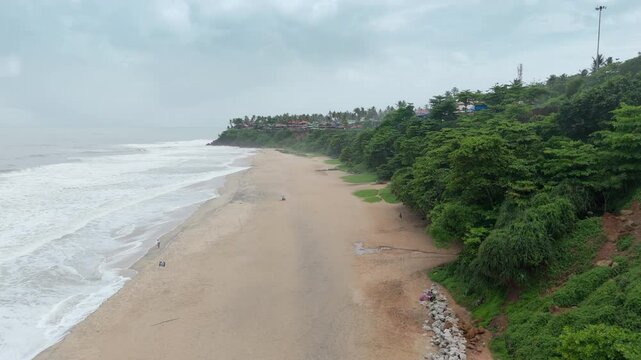 Shoreline of Varkala Cliff Beach, drone view of Varkala beach from the top of the cliff also known as Papanasham Beach, Thiruvananthapuram, Kerala, India