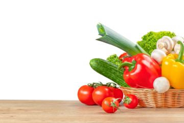 basket with fresh vegetables on wooden table background isolated, Organic vegetables
