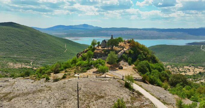 Aerial view away from the Crkva Na Valu Vracenovici church, in sunny Montenegro