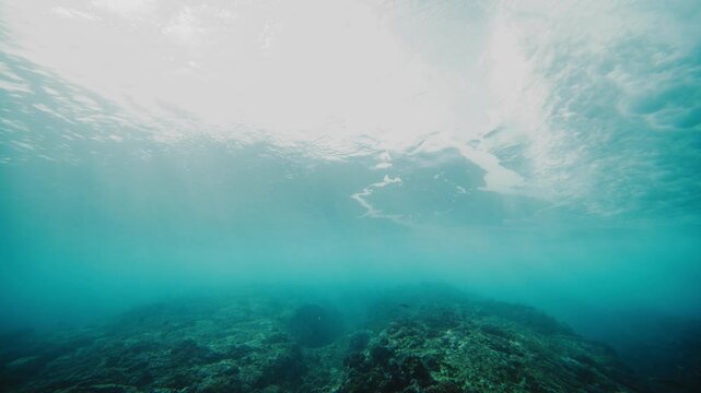 Tracking follows rearview of wave breaking into barrel at Cloudbreak Fiji