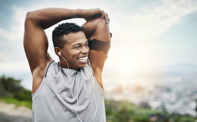 Thinking, fitness and happy black man stretching arms with earphones, outdoor exercise and sunrise. Health, wellness and athlete on hill for muscle warm up, workout and morning inspiration with smile