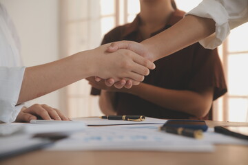 Leaders of business organizations join hands after the meeting is complete. Business partner meeting ideas.