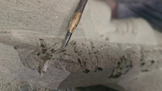 Sculptor Carving On stone. Working with stone and sculpting statue. Extreme Closeup