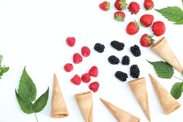 Berries, strawberries, raspberries, blackberries on a white background, free space, horizontal, copy space, top view