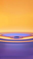 A yellow-orange gradient background with a circular water ripple in the middle