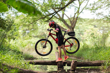 Fototapeta premium Asian are cycling road bike in the morning
