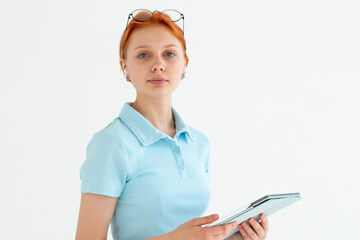 Smiling caucasian young businesswoman use tablet, app for social networks, presentation business, isolated on white studio background. Work and chat on gadget.