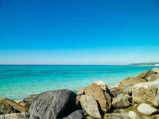 Stones on beach in Vada, Italy.