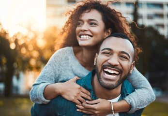 Nature, piggyback and couple in park with love, care and bonding together in outdoor field. Smile, marriage and young man and woman embracing, hugging and having fun on date garden in Mexico.