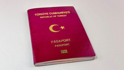 Turkish passport out of EU need visa to travel Europe with red cover before plain white background on the back