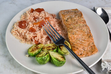baked seasoned salmon served with  brussels sprouts and rice