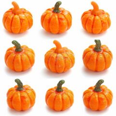 A collection of mini candy pumpkins, isolated on white background