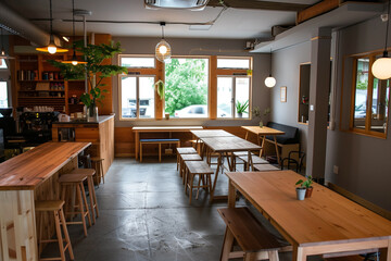 Fototapeta premium Welcoming Event Space and Cafe Interior with Cozy and Bright Atmosphere