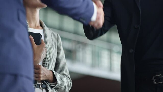 Businessman handshake for teamwork of business merger and acquisition,successful negotiate,hand shake,two businessman shake hand with partner to celebration partnership and business deal concept
