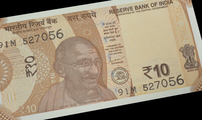 10 Rupees banknote printed by India, that shows Mahatma Gandhi and Ashoka Pillar emblem