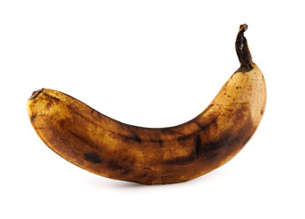 Darkened overripe banana isolated on a white background. Blackened banana peel. Spoiled banana. © Viktor