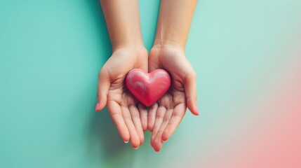 Fototapeta premium hand holding red heart isolated on pastel background