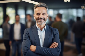 Fototapeta premium Portrait of a mature businessman posing confidently in office