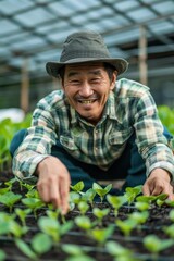 Fototapeta premium 7. Portrait of an Asian farm worker planting organic seedlings, high quality photo, photorealistic, cheerful mood, bright environment