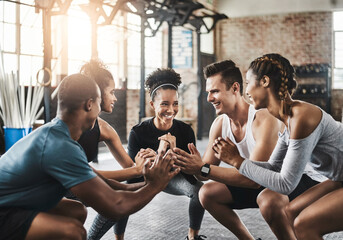 Class, exercise and squat in group at gym for workout, core fitness or training together indoors. Diverse class, friends and warm up for ab muscle, session or sport for health challenge in gymnasium