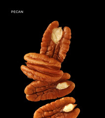Creative layout made of pecan nuts on the black background. Food concept. Macro concept.
