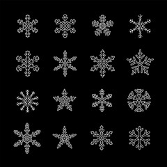 Snowflakes, white line icons. Different patterns and shapes of snowflakes. Ideal for winter and holiday themes. Symbols on black background. Editable stroke.