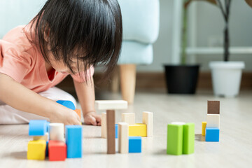 Happy Asian child playing and learning toy blocks. children are very happy and excited at home....
