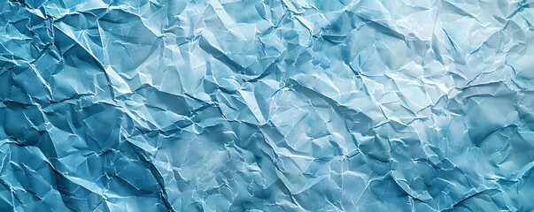 Obraz premium Light blue crumpled paper texture background displaying the intricate folds and creases of the material,