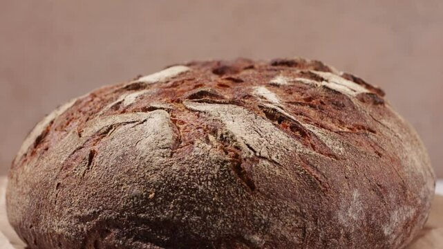 sourdough bread loaf with cracks close up food rotation