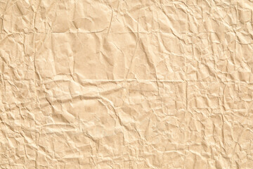 Crumpled and bumpy brown background paper texture